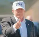  ?? CAROLYN KASTER/ AP ?? President Donald Trump gives the thumbs- up as he walks to board Air Force One in Morristown, New Jersey, Sunday.