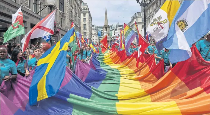  ??  ?? COLOURFUL: Members of the LGBT community take part in the annual Pride Parade in London this month. The British capital is dealing with the effects of chemsex.