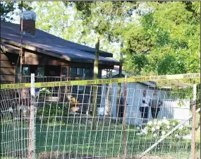  ?? TIMES photograph by Annette Beard ?? Benton County Sheriff’s Office detectives kept watch outside of the home of Ruby Ross, 11001 Blue Jay Road Thursday morning.