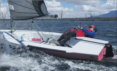  ??  ?? CATCHING THE BREEZE: Stawell Yacht Club’s Ross Bennett in his Impulse dinghy ‘In a Pink fit’ when he won the club’s 2020-2021 pennant series title.