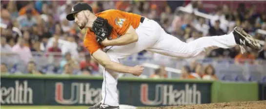  ??  ?? MIAMI: Marlins relief pitcher Carter Capps (22) throws to the San Francisco Giants during the eighth inning of a baseball game.The Marlins won 5-4. —AP