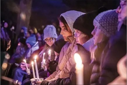  ?? SCOTT ASH — VIA THE ASSOCIATED PRESS ?? A candleligh­t vigil for those affected by the Waukesha Christmas parade tragedy on Monday in Wisconsin. Five people were killed in the crash.