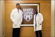  ?? ASSOCIATED PRESS ?? IN THIS JUNE 28, 2018 PHOTO provided by Arizona State University Media Relations, Arizona State wide receiver Kyle Williams, right, poses with Dr. Anikar Chhabra, the team physician and director of sports medicine, at the Mayo Clinic in Scottsdale, Ariz.