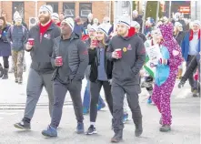  ??  ?? A little hot coffee helps when like-minded individual­s gather to make a difference at the Coldest Night of the Year walk in Kentville.