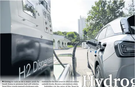  ??  ?? LEFT
A Hyundai Nexo hydrogen car is fuelled at a hydrogen station in Seoul.