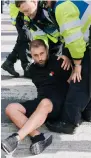  ?? ?? Officers arrest the fan outside Wembley Stadium in London.