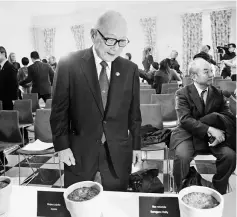  ??  ?? Japanese Nagasaki survivor, Tanaka Terumi, who is also secretary-general of Nihon Hidankyo, a Japan-wide organisati­on of atomic and hydrogen bomb sufferers, looks at the pots of planted ‘peace seeds’ in the Natural History Museum in Oslo, Norway. The...