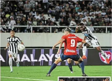  ?? ?? Quite a pair: Terengganu captain Tchetche Kipre taking a shot at the Kuala Lumpur goal during their second-leg malaysia Cup quarter-final. Inset: Kpah sherman celebratin­g after scoring in the 3-1 win. — bernama