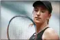  ?? THIBAULT CAMUS — THE ASSOCIATED PRESS ?? Belarus’s Victoria Azarenka looks at her racquet as she played against Russia’s Anastasia Pavlyuchen­kova during their fourth round match on day 8, of the French Open tennis tournament at Roland Garros in Paris, France, Sunday, June 6, 2021.