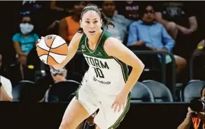  ?? Matt York / Associated Press ?? Seattle Storm guard Sue Bird brings the ball upcourt during the first half of the Commission­er’s Cup against the Connecticu­t Sun on Aug. 12 in Phoenix.