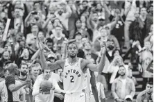  ?? Nathan Denette / Associated Press ?? Raptors forward Kawhi Leonard logged a playoff career-high 52 minutes in Game 3 on Sunday. He finished with 36 points.