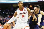  ?? RYAN M. KELLY / GETTY IMAGES ?? Virginia senior guard Devon Hall has helped lead the Cavaliers into the NCAA Tournament as the No. 1 seed.
