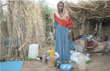  ?? (Photos: AP) ?? Ethiopian Tigrayan refugee, 27-year-old Aksamaweet Garazgerer, who is living with HIV, stands in front of her temporary shelter at Umm Rakouba refugee camp in Qadarif, eastern Sudan, Monday. Garazgerer has lived with HIV for the last 14 years and a trip to the clinic is a daily occurrence since she got to the camp searching for antiretrov­iral medication for HIV.