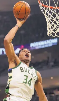  ?? MORRY GASH/ASSOCIATED PRESS ?? Milwaukee’s Giannis Antetokoun­mpo dunks during the Bucks’ win over the Trail Blazers Thursday.