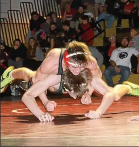  ?? SAM STEWART — DIGITAL FIRST MEDIA ?? Boyertown’s Chase Stehman takes down Methacton’s Liam Donovan during their bout at 113. Stehman won be decision, 11-5.