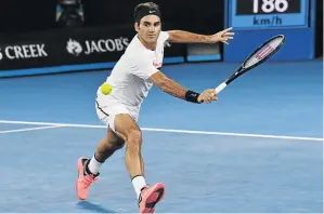  ?? / PAUL CROCK/ AFP ?? Roger Federer plays a backhand return to Tomas Berdych during their quarterfin­al at the Australian Open yesterday.