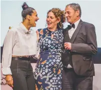  ??  ?? Annemarie Jacir (centre) celebrates with Mohammad Bakri after winning the best feature film category award.