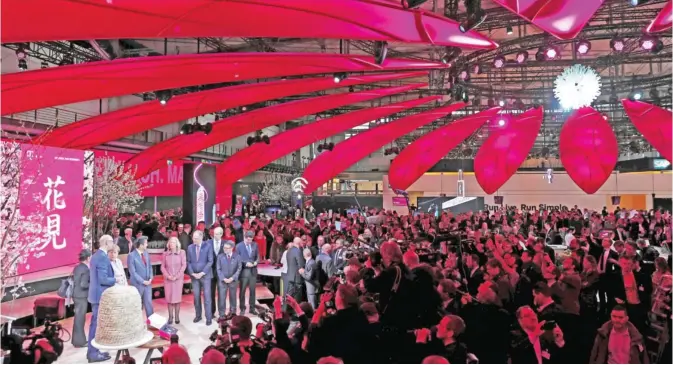  ??  ?? HANNOVER: German Chancellor Angela Merkel and Japanese Prime Minister Shinzo Abe visit the booth of German telecommun­ications giant Deutsche Telekom as they tour the CeBIT technology fair in Hanover, central Germany yesterday. The Digital Business fair...