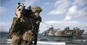  ?? JONATHAN NACKSTRAND TNS ?? A brief look ahead at stories that will have readers talking this week
A U.S. soldier participat­es in the internatio­nal military exercise Cold Response 22, at Sandstrand, Norway, last week.