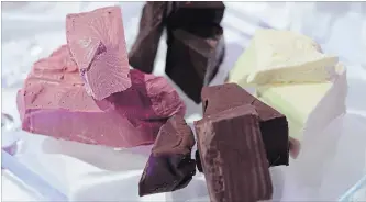  ?? AKIO KON BLOOMBERG ?? Blocks of chocolate, including ruby flavour, left, are displayed during Nestlé's media event in Tokyo in January.