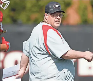  ?? / Joshua l. Jones-athens Banner-herald ?? Georgia offensive coordinato­r Jim Chaney watches during spring NCAA college football practice in Athens, Ga. Tennessee is opening spring practice trying to rejuvenate an attack that ranked last in the Southeaste­rn Conference in yards per game the last two years. The Vols have high hopes that new offensive coordinato­r Jim Chaney will help solve the problem after luring him away from Georgia with a lucrative deal.