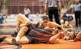  ?? NATE HECKENBERG­ER - FOR DIGITAL FIRST MEDIA ?? Exeter’s Tyler Bagoly works for back points against Boyertown’s Elijah Jones at 182in the first round of the PIAA Team Wrestling Championsh­ips on Feb. 9.