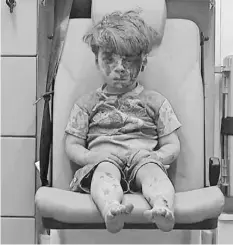  ?? ALEPPO MEDIA CENTER VIA AP ?? Video frame grab of Omran Daqneesh, who was rescued in Aleppo, Syria, last week. He survived. His brother did not.