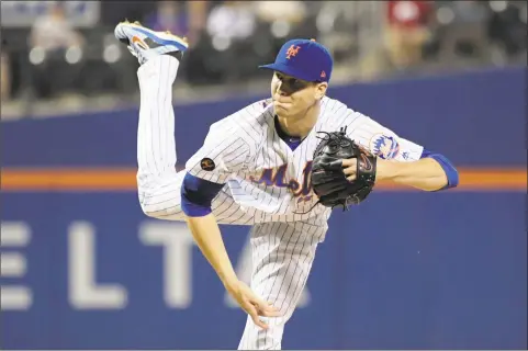  ?? Bill Kostroun / Associated Press ?? New York Mets pitcher Jacob deGrom delivers the ball against the Atlanta Braves on Sept. 26 in New York. DeGrom won the National League Cy Young Award on Wednesday.