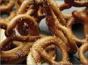  ?? PHIL MANSFIELD — THE CULINARY INSTITUTE OF AMERICA VIA AP ?? This photo provided by The Culinary Institute of America shows soft pretzels in Hyde Park, N.Y. This dish is from a recipe by the CIA.