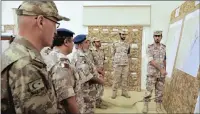  ?? PICTURE: EPA ?? Turkish and Qatar soldiers meet before a military exercise in Qatar on Sunday. In June, Turkey announced the deployment of hundreds of troops to a base near Doha.