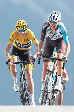  ??  ?? At the limit: Chris Froome (left) goes wheel to wheel with Romain Bardet