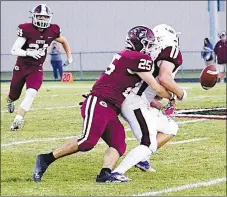  ?? Westside Eagle Observer/RANDY MOLL ?? Gentry’s Jonathan Corter, with Bennett Roberts coming to assist, tackles the Huntsville quarterbac­k and knocks the ball loose during play in Pioneer Stadium on Friday night.