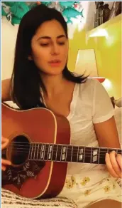  ?? (Photo: IANS) ?? Actress Katrina Kaif is seen playing guitar as coronaviru­s forces her to go into self-isolation.