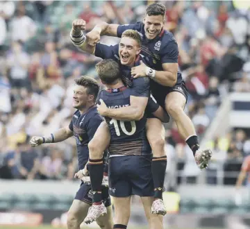  ??  ?? 0 Scotland players celebrate seconds after beating England in the final at Twickenham yesterday.