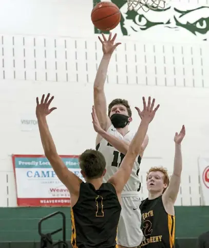  ?? Matt Freed/Post-Gazette ?? Pine-Richland’s Luke Shanahan drives to the basket against North Allegheny’s Greg Habib, left. Shanahan led the Rams with 20 points.