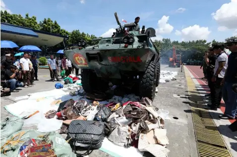  ??  ?? ILLEGAL GOODS.Law enforcemen­t and regulatory member bodies of the National Committee on Intellectu­al Property Rights and Intellectu­al Property Office of the Philippine­s destroy PHP11.8 million worth of pirated goods at the Philippine National Police...
