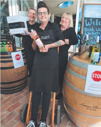  ??  ?? COMING BACK: Lyndsay Sharp, right, with staff Tim Thornton and Bree Bradon at Leura Park, which last week reopened its cellar door.