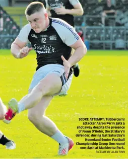  ?? PICTURE BY ALAN FINN ?? SCORE ATTEMPT: Tubbercurr­y attacker Aaron Perry gets a shot away despite the presence of Fionn O’Hehir, the St Mary’s defender, during last Saturday’s Homeland Senior Football Championsh­ip Group One round one clash at Markievicz Park.