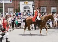  ?? Scott Mullin / Hearst Connecticu­t Media file photo ?? British soldiers move up Main Street toward the Continenta­l Army for the 240th anniversar­y of the Battle of Ridgefield on April 29, 2017