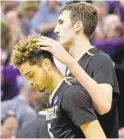  ?? RICK BOWMER/ ASSOCIATED PRESS ?? Vanderbilt's Luke Kornet, right, consoles guard Matthew Fisher-Davis after the team’s loss in which Fisher-Davis intentiona­lly fouled a Northweste­rn player with 15 seconds left even though his teamhad the lead.