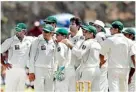  ??  ?? Pakistan's cricket team players watch the dismissal of Tillakarat­ne Dilshan