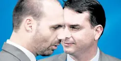  ?? —REUTERS ?? BROTHERS BOLSONARO Brazilian Federal Deputy Eduardo Bolsonaro (left) stands near his brother Sen. Flavio Bolsonaro during a public function in October 2019.