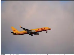  ?? (AP) ?? A DHL cargo Boeing 757 approaches for a landing in Lisbon, Spain, earlier this month.