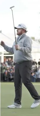  ?? AP FOTO ?? DROUGHT OVER. J.B. Holmes celebrates his first victory in three years, which earns him a trip to the Masters.