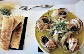  ??  ?? Escargot from Bistro 22, which opened in Edmond in late 2017.