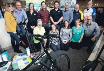  ?? JASON BAIN EXAMINER ?? Canadian Mental Health Associatio­n Haliburton, Kawartha, Pine Ridge staff are joined by Ride Don’t Hide sponsors after details about the third annual fundraiser were announced at the Leon’s store on Thursday.