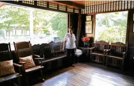  ??  ?? Belen Bautista welcomes visitors to her splendid “bahay-kubo.”