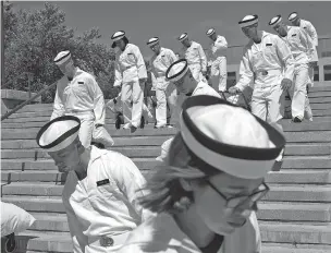  ?? ASSOCIATED PRESS FILE PHOTO ?? Incoming plebes carry their belongings down a staircase during Induction Day last month at the U.S. Naval Academy in Annapolis, Md. An analysis released Tuesday shows the percentage of female students nominated by members of Congress for admission to U.S. service academies has been rising, although men are still put forward at numbers nearly three times higher than women.