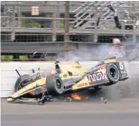  ?? JIMMY DAWSON, THE INDIANAPOL­IS STAR ?? “It’s something we accept because of our passion,” says James Hinchcliff­e, who nearly died after this crash May 18, 2015.