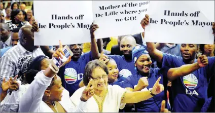  ?? Picture: David Ritchie/African News Agency/ANA ?? NOT LACKING FOR SUPPORT: Mayor Patricia de Lille is led by supporters holding posters to the stage at the World Harvest Christian Ministry church in Langa on Sunday, where she was invited to speak and congregant­s prayed for her.